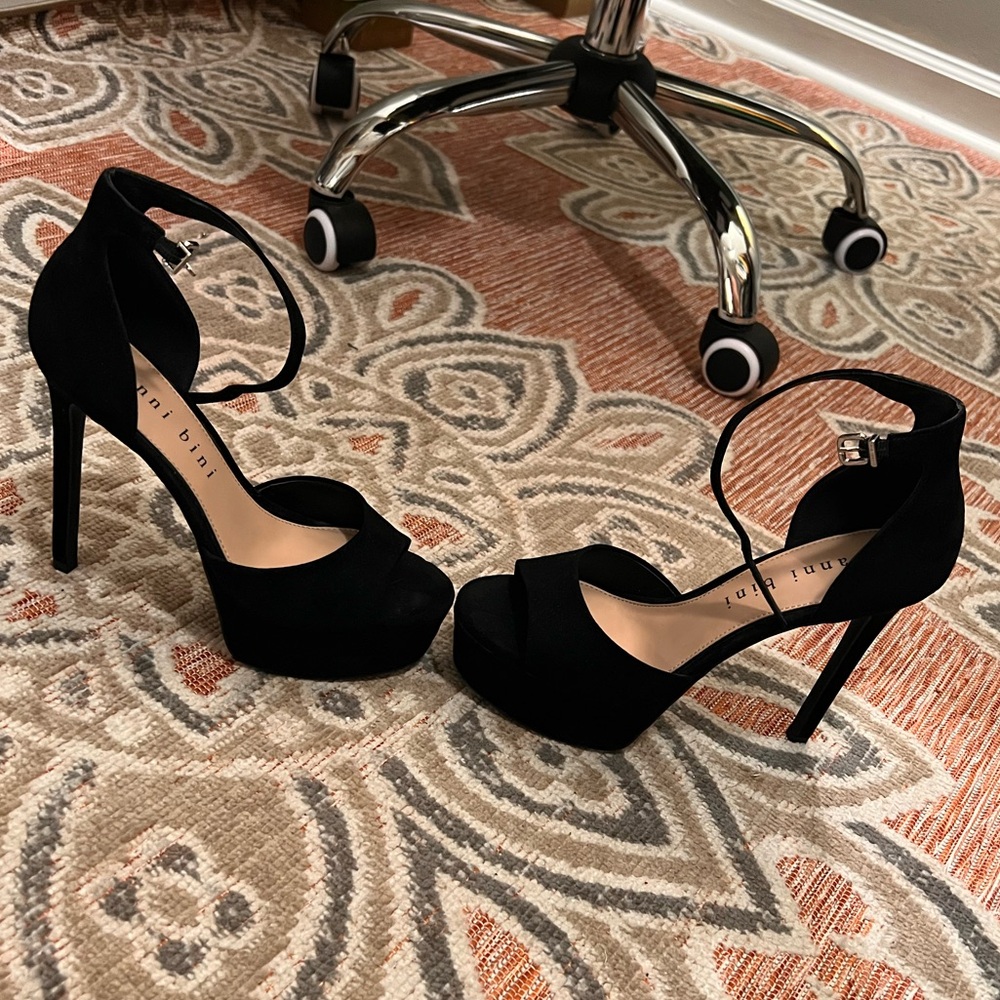 From Gianni Bini, the Chellsie Leather Ankle Strap Stiletto Platform Sandals